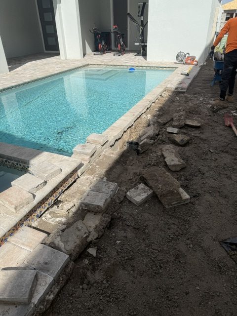 Pool deck demolition and base prep before paver installation