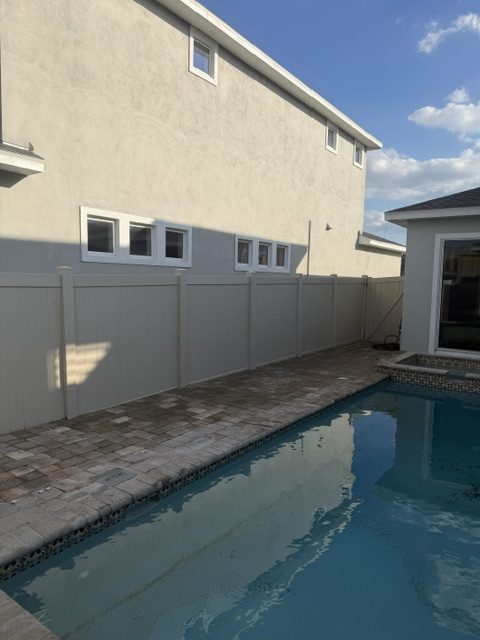 Completed pool deck pavers with clean coping edge